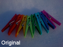 Original, is not processed, dark picture, colorful clothespins on snow